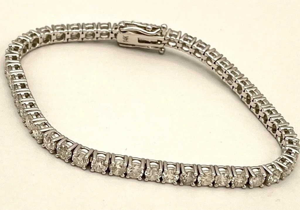 Close-up photo of a 14-karat-gold diamond bracelet on display.