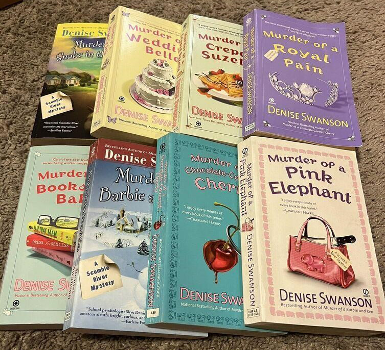 An eight-book collection of murder mystery books with pastel-colored covers.
