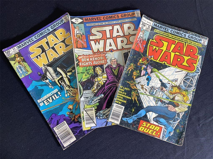 Three colorful Marvel Comics Group “Star Wars” comics fanned across a table.