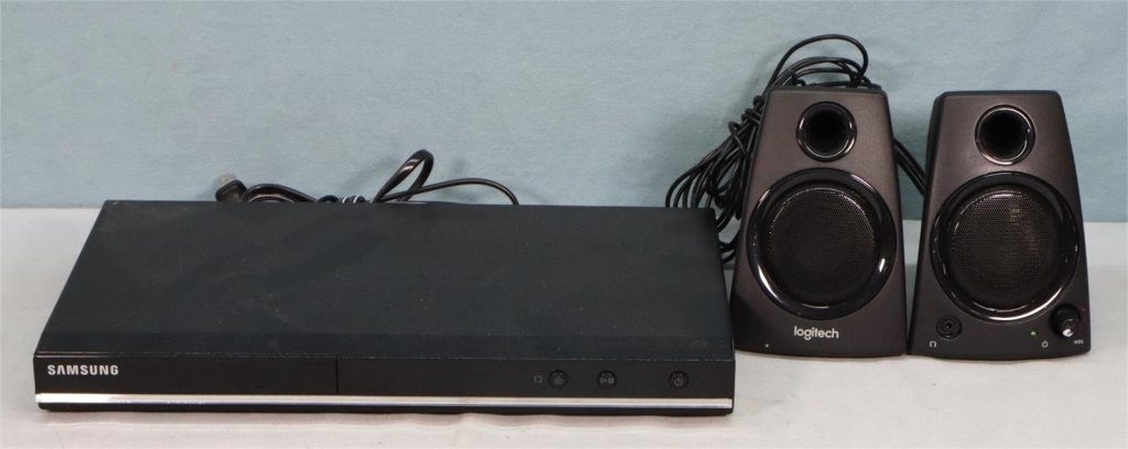 Samsung DVD player and Logitech portable speakers.
